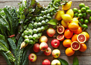 a group of fruits and vegetables on a wood surface Healthy Weight Loss Diets Gloucestershire